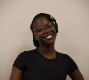 portrait of young woman with glasses and black tshirt